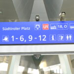 Sign in train station giving directions to trains and station services