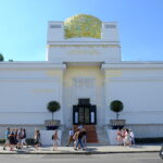 Secession building in Vienna a large white building with gold accents