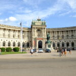 The Heldenplatz at the Hofburg in Vienna, a courtyard in front of a wide stone palace