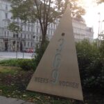 Triangular metal memorial that reads 369 weeks and wochen