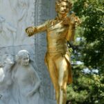 Golden statue of Johann Strauss playing a violin